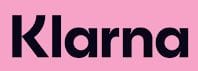 Klarna logo in bold black letters on a pink background, symbolizing simple payment plans and easy enrollment procedures for affordable dog grooming training.